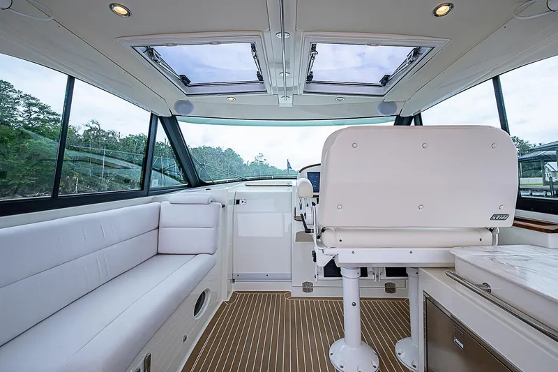 Slide: The Image of Interior of 2023 Hinckley Sport Boat 40 X, featuring luxurious seating and modern design. - 13