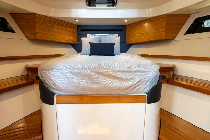 Slide: The Image of Luxurious cabin interior of 2023 Boston Whaler 405 Conquest with elegant wood accents. - 13