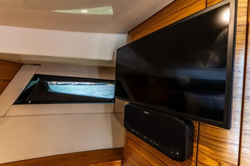Slide: The Image of Interior of 2023 Boston Whaler 405 Conquest with TV and window view. - 14