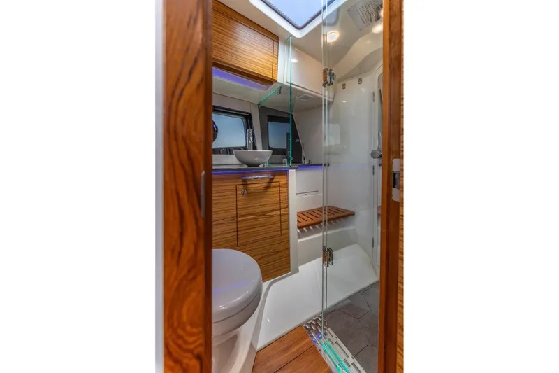 Slide: The Image of Luxurious bathroom interior of 2023 Boston Whaler 405 Conquest boat with modern fixtures. - 17