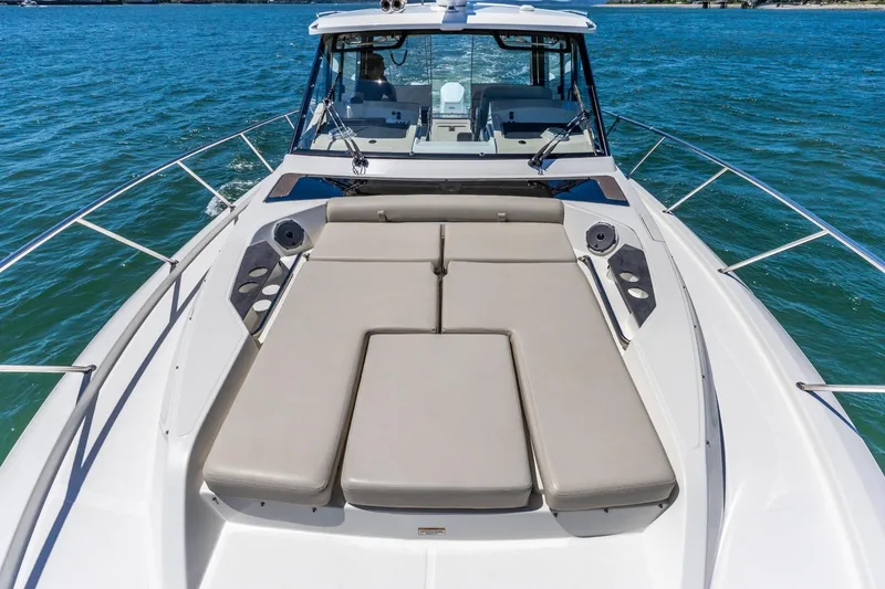 Slide: The Image of 2023 Boston Whaler 405 Conquest boat with spacious deck and luxurious seating on the water. - 23