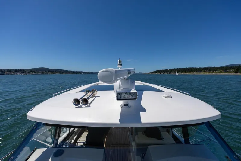Slide: The Image of 2023 Boston Whaler 405 Conquest cruising on a sunny day, showcasing sleek design and advanced radar. - 24