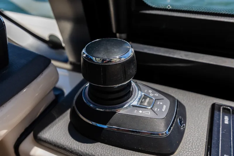 Slide: The Image of Joystick control on 2023 Boston Whaler 405 Conquest boat dashboard. - 29
