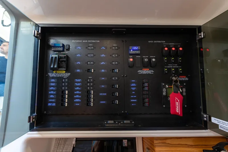 Slide: The Image of Electrical panel of 2023 Boston Whaler 405 Conquest boat, showcasing controls and distribution systems. - 32