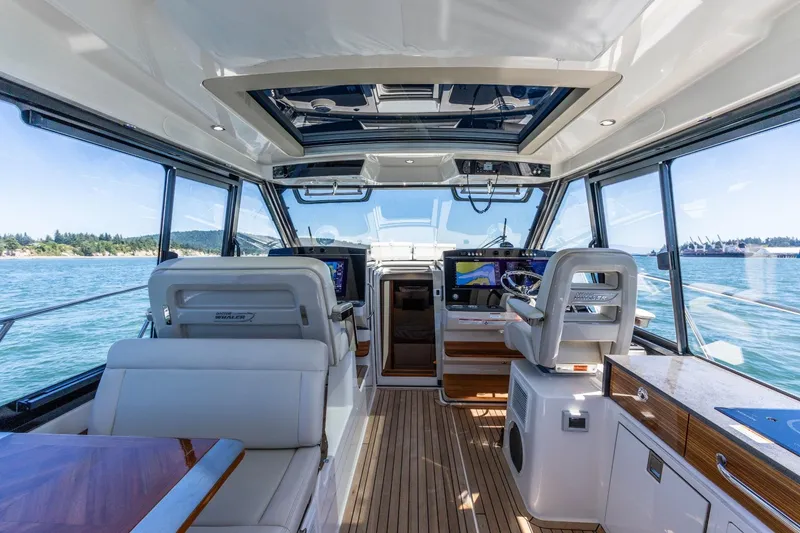 Slide: The Image of Interior of 2023 Boston Whaler 405 Conquest yacht, featuring luxurious seating and advanced navigation systems. - 5