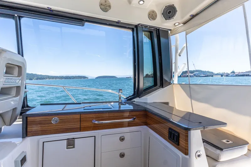 Slide: The Image of Interior view of 2023 Boston Whaler 405 Conquest yacht with ocean backdrop. - 7