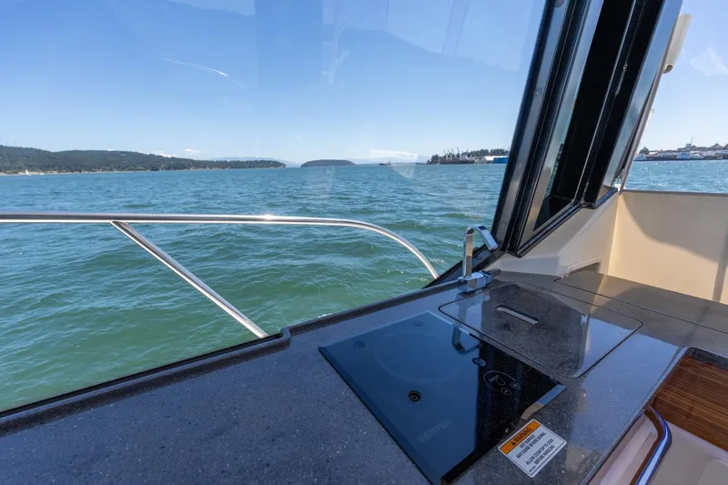 Slide: The Image of Interior view of 2023 Boston Whaler 405 Conquest yacht with ocean backdrop. - 8