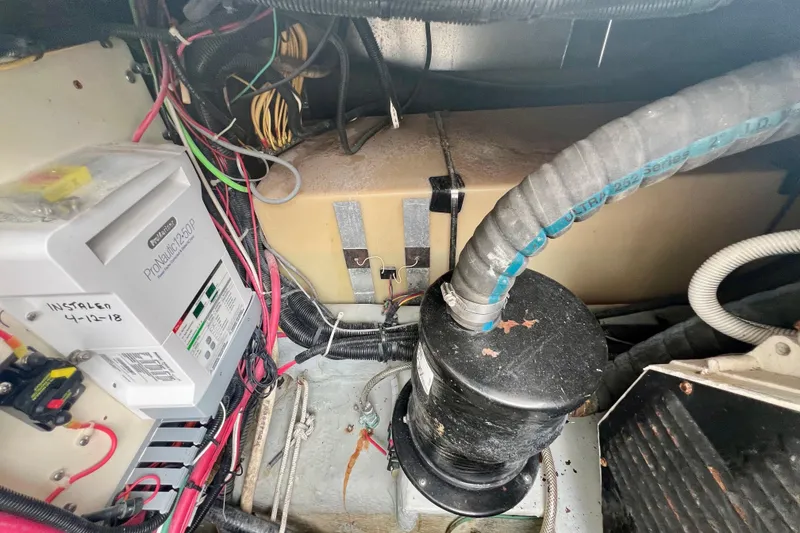Slide: The Image of Engine room of 1999 Mainship 350 Trawler with wiring and equipment. - 52