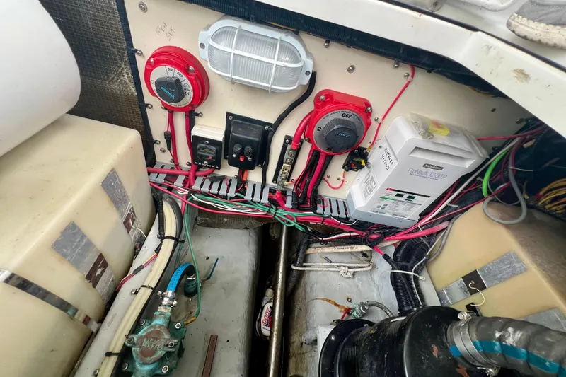 Slide: The Image of Electrical system of a 1999 Mainship 350 Trawler, featuring wiring and control panels. - 53