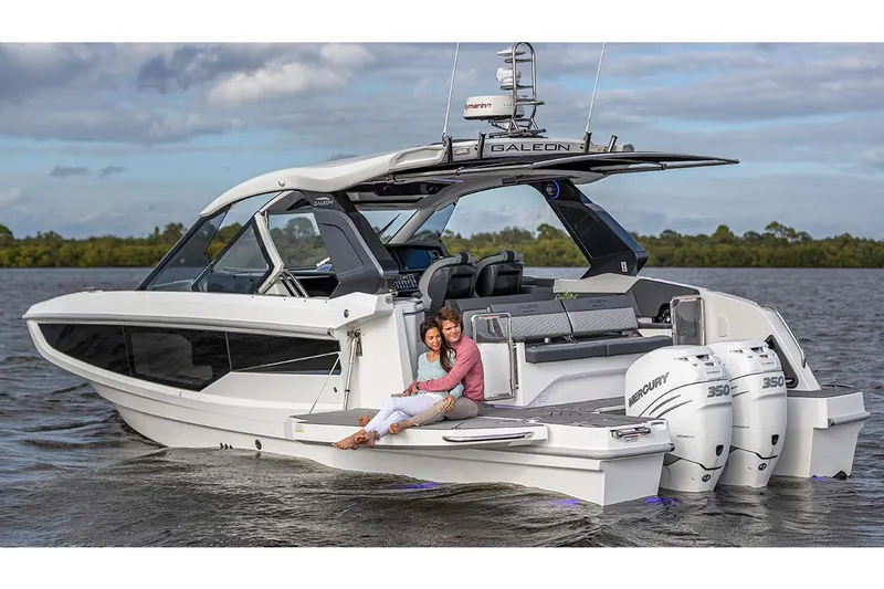 Slide: The Image of Manufacturer Provided Image: 2025 Galeon 335 GTO luxury yacht on water, featuring sleek design and powerful Mercury engines. - 2