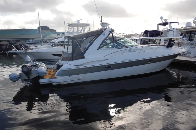 The Image of 2007 Cruisers 340 Express yacht docked at marina, side view. - 0