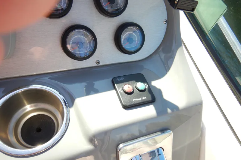 Slide: The Image of Dashboard of 2007 Cruisers 340 Express with gauges and thruster controls. - 12