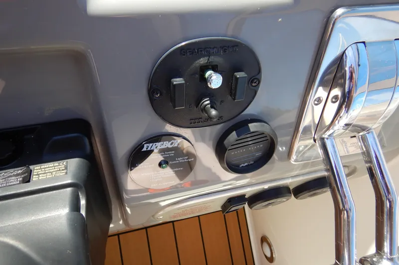 Slide: The Image of 2007 Cruisers 340 Express dashboard with controls and Fireboy system. - 13