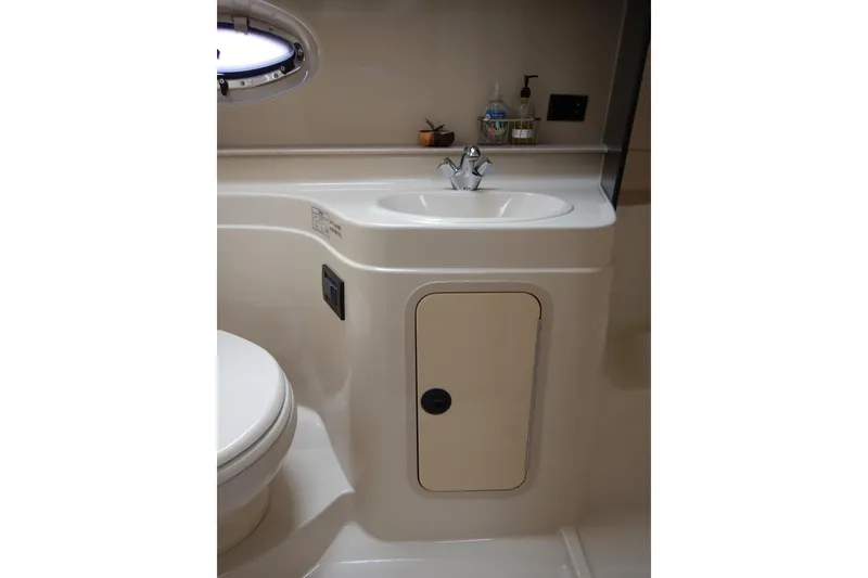 Slide: The Image of Bathroom interior of 2007 Cruisers 340 Express yacht, featuring sink and storage. - 41