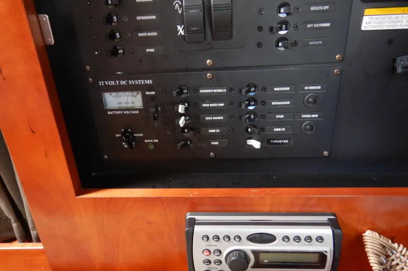 Slide: The Image of 2007 Cruisers 340 Express control panel with 12-volt DC systems and stereo unit. - 46