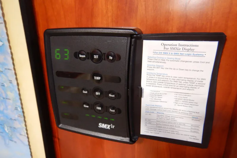 Slide: The Image of SMXir display panel with operation instructions on a 2007 Cruisers 340 Express. - 47