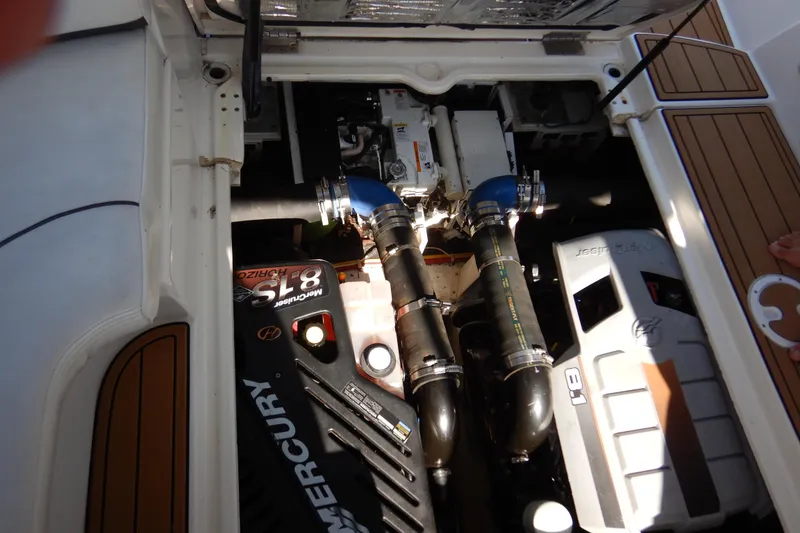 Slide: The Image of 2007 Cruisers 340 Express engine compartment with Mercury 8.1 engines and detailed components. - 48