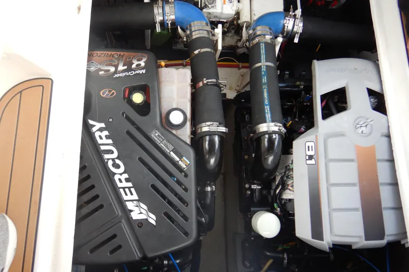 Slide: The Image of Engine compartment of a 2007 Cruisers 340 Express with Mercury 8.1 engines. - 49
