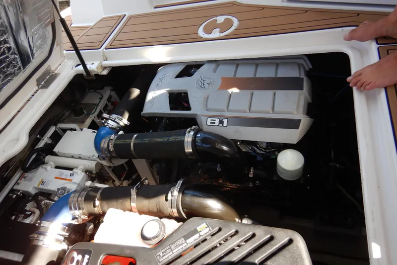 Slide: The Image of Engine compartment of a 2007 Cruisers 340 Express boat, featuring an 8.1 engine. - 50