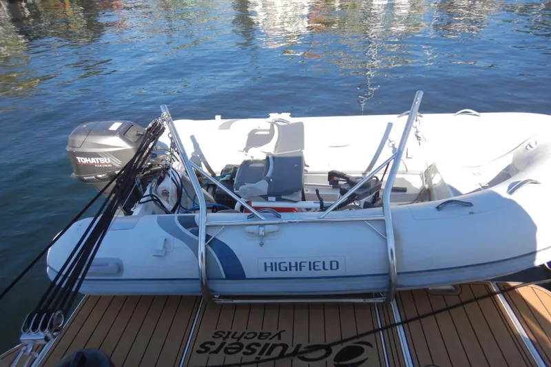 Slide: The Image of 2007 Cruisers 340 Express with Highfield inflatable boat and Tohatsu motor on water. - 57