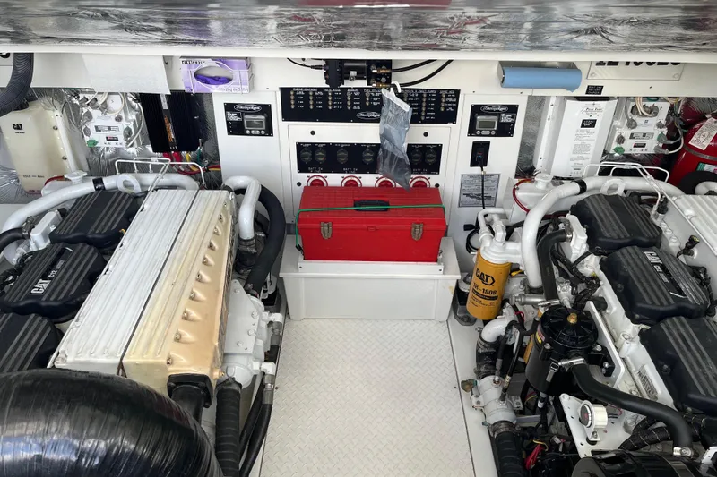 Slide: The Image of Engine room of 2011 Rampage 41 Express boat with CAT engines and control panel. - 10