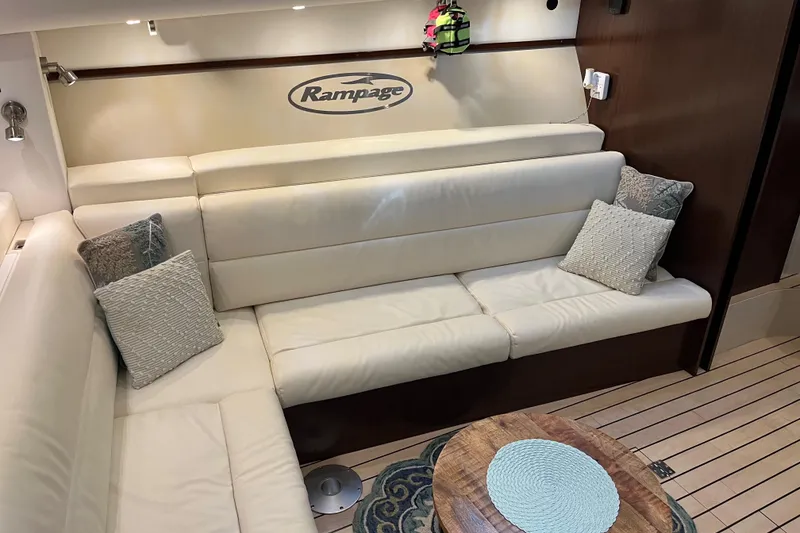 Slide: The Image of Luxurious interior of 2011 Rampage 41 Express yacht with white leather seating and wooden accents. - 16