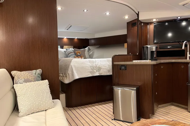 Slide: The Image of Luxurious interior of 2011 Rampage 41 Express yacht with cozy bed and modern kitchenette. - 17