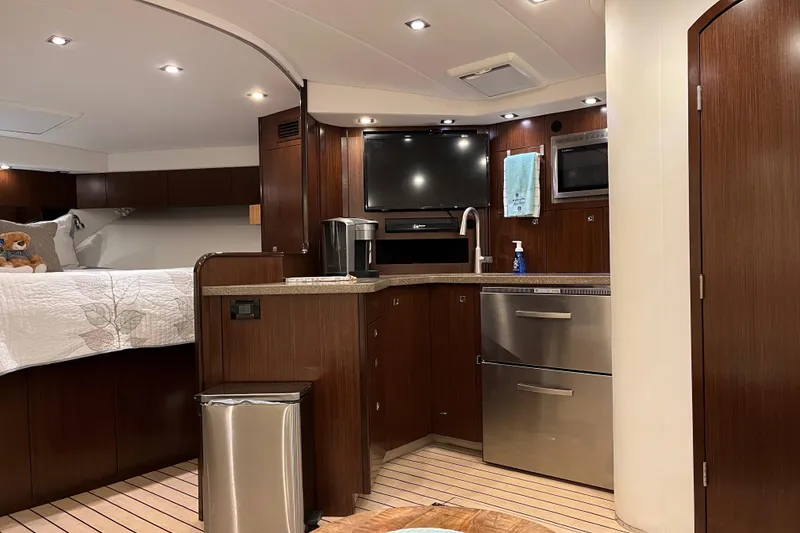 Slide: The Image of Luxurious interior of 2011 Rampage 41 Express yacht with modern kitchen and cozy sleeping area. - 18
