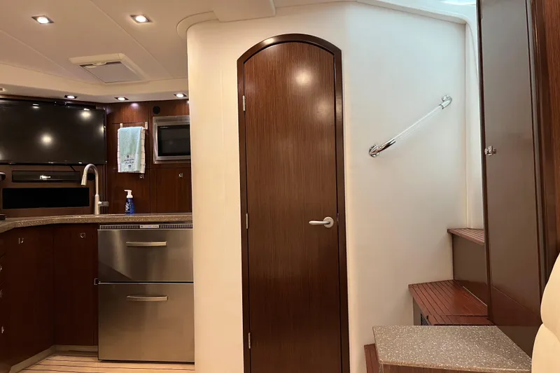 Slide: The Image of Luxurious interior of 2011 Rampage 41 Express yacht with modern kitchen and wooden finishes. - 19