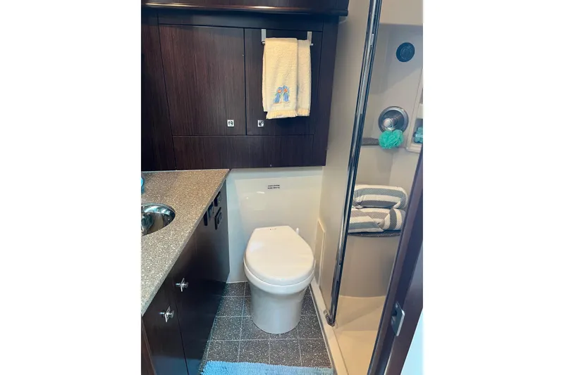 Slide: The Image of Luxurious bathroom in 2011 Rampage 41 Express yacht with modern fixtures and elegant design. - 20