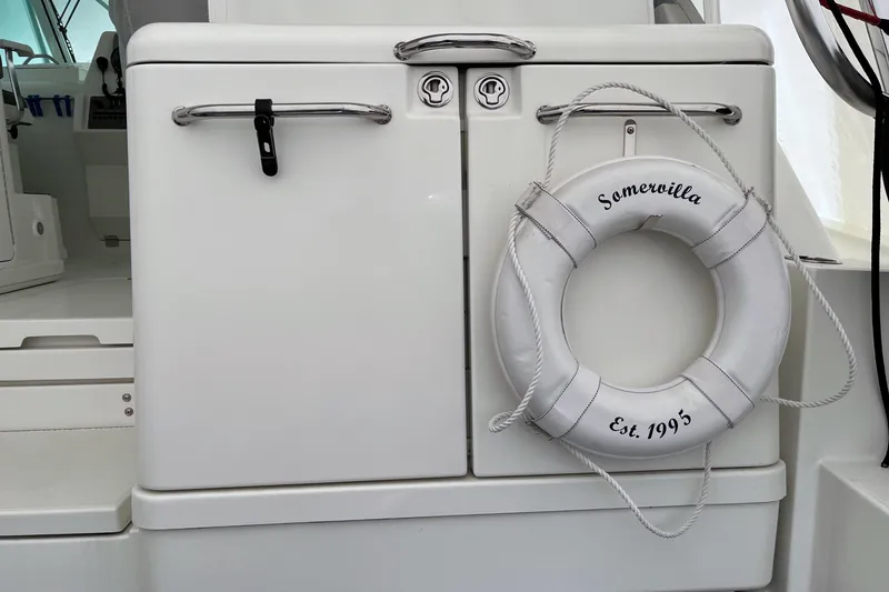 Slide: The Image of 2011 Rampage 41 Express boat with life preserver labeled "Somerville Est. 1995." - 6