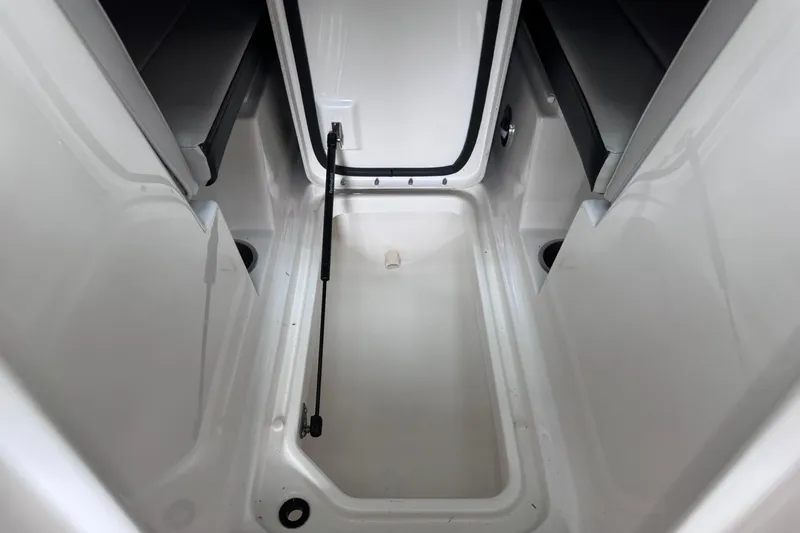 Slide: The Image of 2021 Sea Ray SPX 230 boat storage compartment, open and empty. - 19