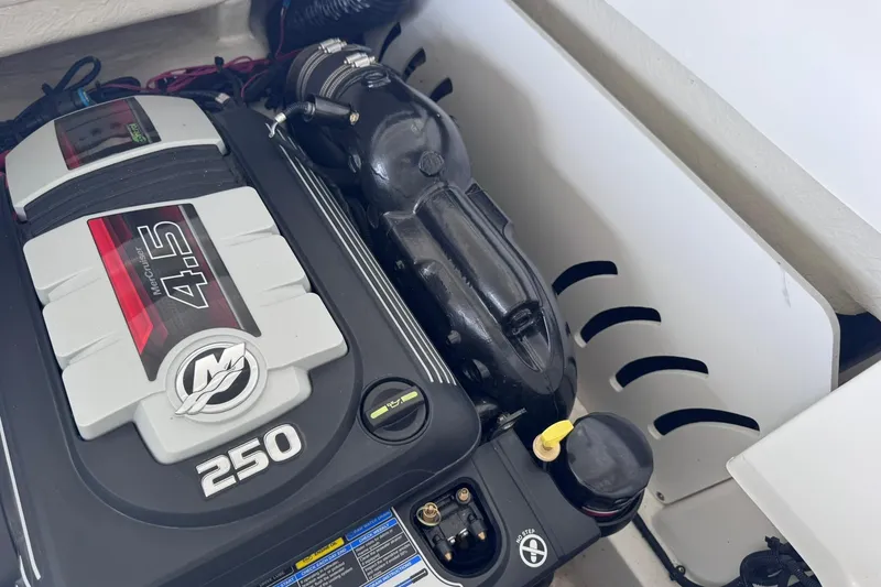 Slide: The Image of Engine compartment of a 2021 Sea Ray SPX 230 with MerCruiser 4.5L 250 HP engine. - 25
