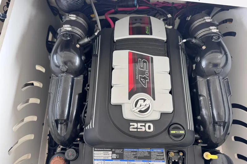 Slide: The Image of Engine compartment of a 2021 Sea Ray SPX 230 with MerCruiser 4.5L engine. - 27