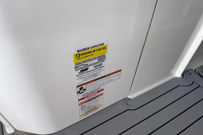 Slide: The Image of Capacity label on 2021 Sea Ray SPX 230 boat, maximum 13 persons or 2100 lbs. - 9
