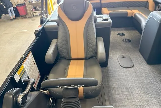 Slide: The Image of Captain's chair on 2026 Godfrey Monaco 23' Ultra Lounge Tritoon, featuring luxurious seating and controls. - 10