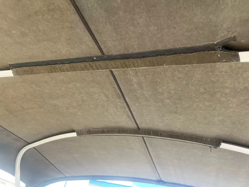 Slide: The Image of The image shows the canopy of a 2015 Sylvan 8522 CNF boat. - 16