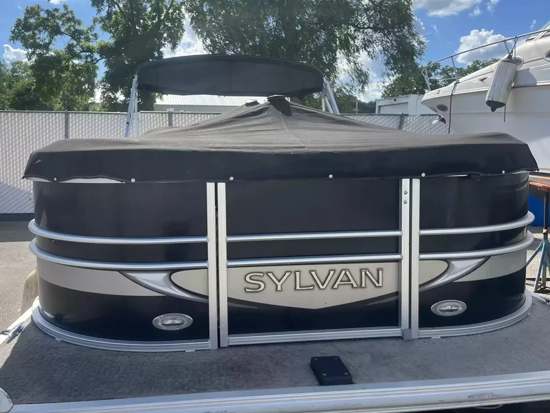 Slide: The Image of 2015 Sylvan 8522 CNF pontoon boat with cover, parked outdoors. - 19
