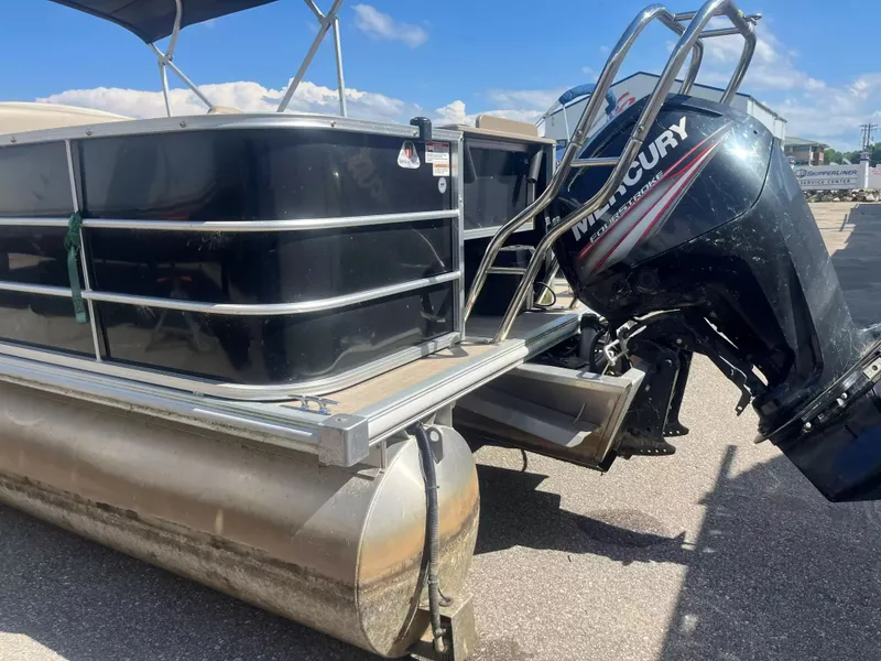 Slide: The Image of A 2015 Sylvan 8522 CNF pontoon boat with a Mercury outboard motor, parked on a lot. - 23