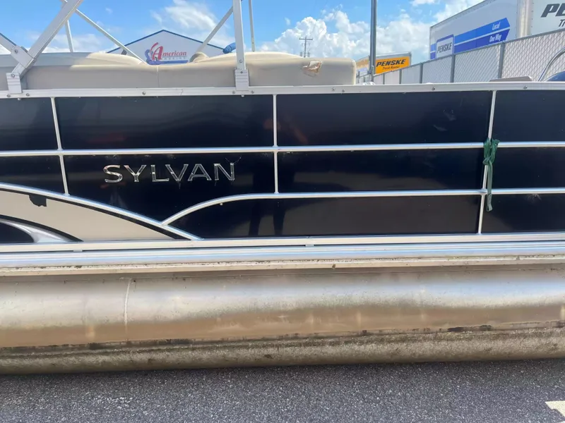Slide: The Image of 2015 Sylvan 8522 CNF pontoon boat with black hull, parked on a lot. - 5