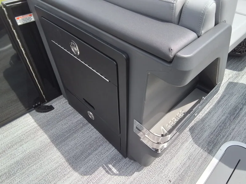 Slide: The Image of Close-up of a seating area with storage and gray upholstery. - 16