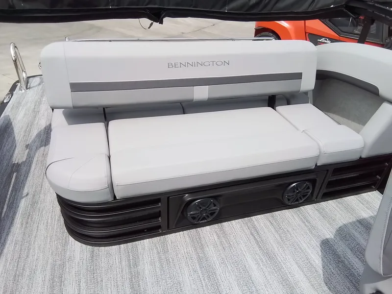 Slide: The Image of The image shows a luxurious seating area on a Bennington boat. - 20