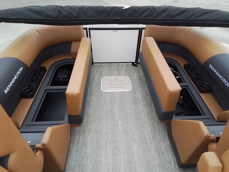 Slide: The Image of Interior of a Bennington 23SSRSF boat with brown and black seating. - 18