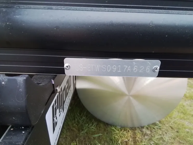 Slide: The Image of Close-up of a boat trailer with a serial number plate. - 28