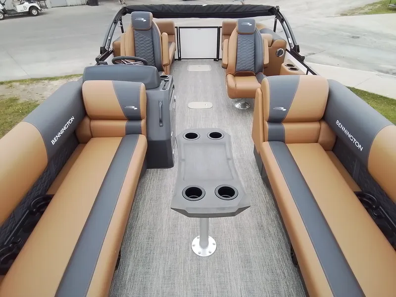 Slide: The Image of Interior of a Bennington 23SSRSF pontoon boat with brown and gray seating. - 9