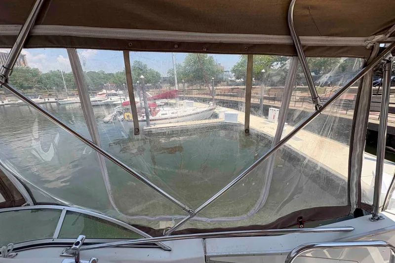 Slide: The Image of View from 2001 Bayliner 3258 Command Bridge, overlooking marina with docked boats. - 5