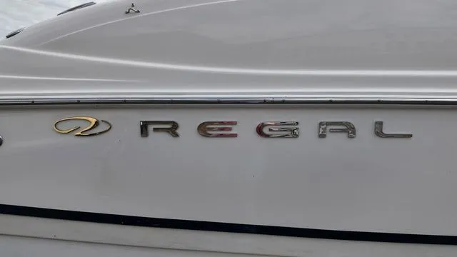 Slide: The Image of Close-up of the "Regal" lettering on a boat hull. - 26