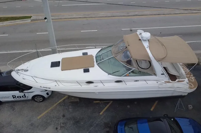 The Image of 2002 Sea Ray 340 Sundancer boat parked on a lot, viewed from above. - 0