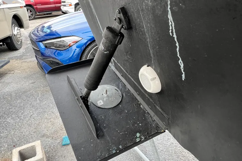 Slide: The Image of Close-up of a 2002 Sea Ray 340 Sundancer boat's trim tab and hull detail. - 15
