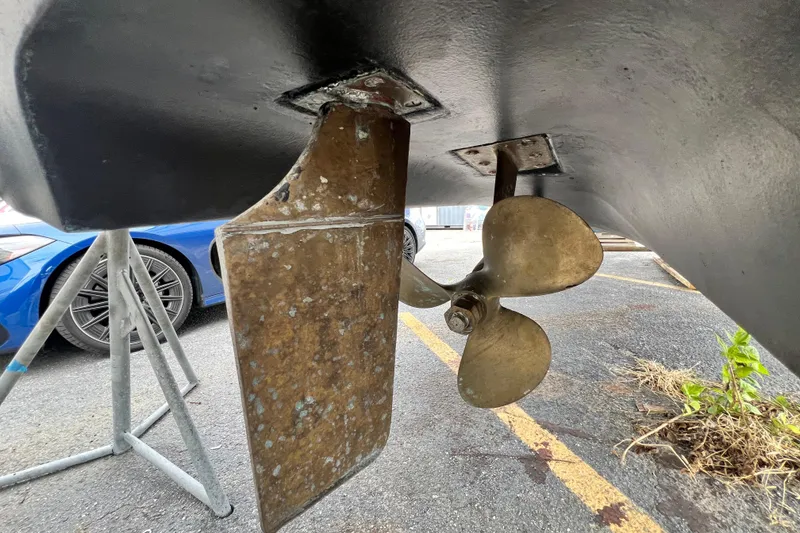 Slide: The Image of Propeller and rudder of 2002 Sea Ray 340 Sundancer boat in dry dock. - 16